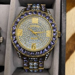 Heidi Daus watch. With lavender crystals. Needs a battery. I’m open to offers.